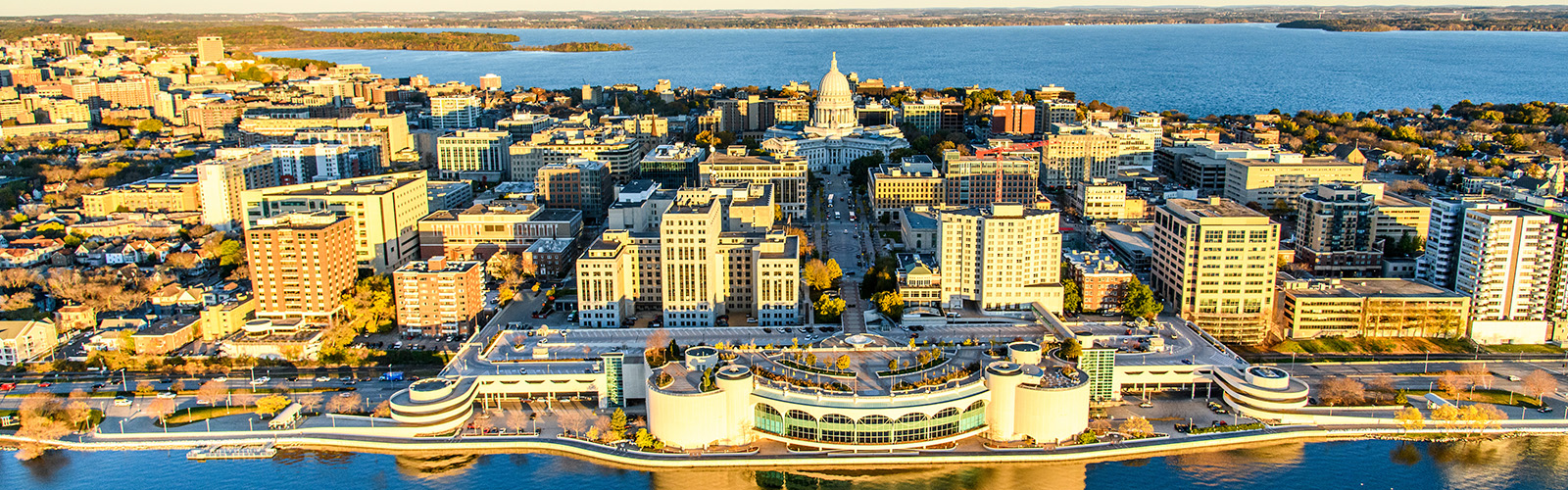 Lake Mendota and Lake Monona, along with the downtown Madison Isthmus and Wisconsin State Capitol, are pictured in an early morning aerial taken from a helicopter on Oct. 23, 2018. (Photo by Bryce Richter /UW-Madison)