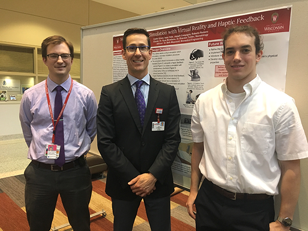 Resident Brandon Tomlin, MD, and Ryan McAdams, MD, with UW Department of Biomedical Engineering undergraduate student Joseph Campagna