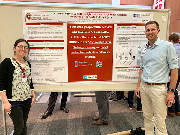 Resident Emma Huang, MD, and Neonatology and Newborn Nursery faculty member Matthew Harer, MD, by their poster on the need for renal function follow-up for very low birth weight preterm infants with acute kidney injury.