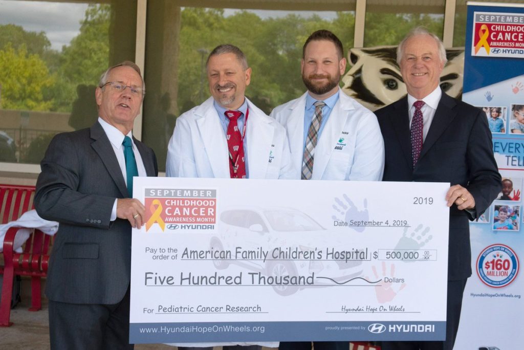 Drs. Otto and Pytel presented with check