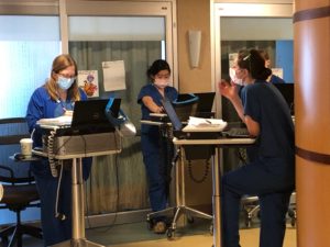 3 doctors and nurses at laptops