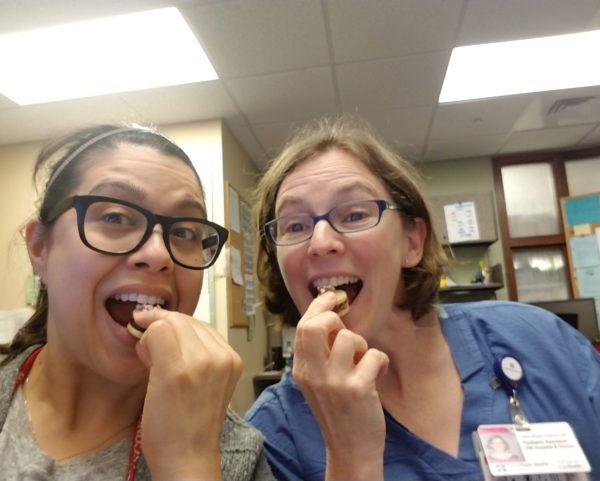 two people eating cookies