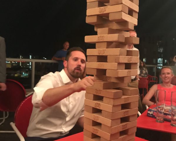 a person playing Jenga