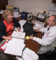 two people sitting at a desk