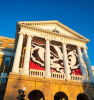 Bascom Hall with a large Bucky Badger flag.