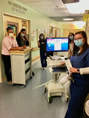 doctors going on rounds in a hospital hallway