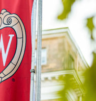 University of Wisconsin @ shield on a red banner