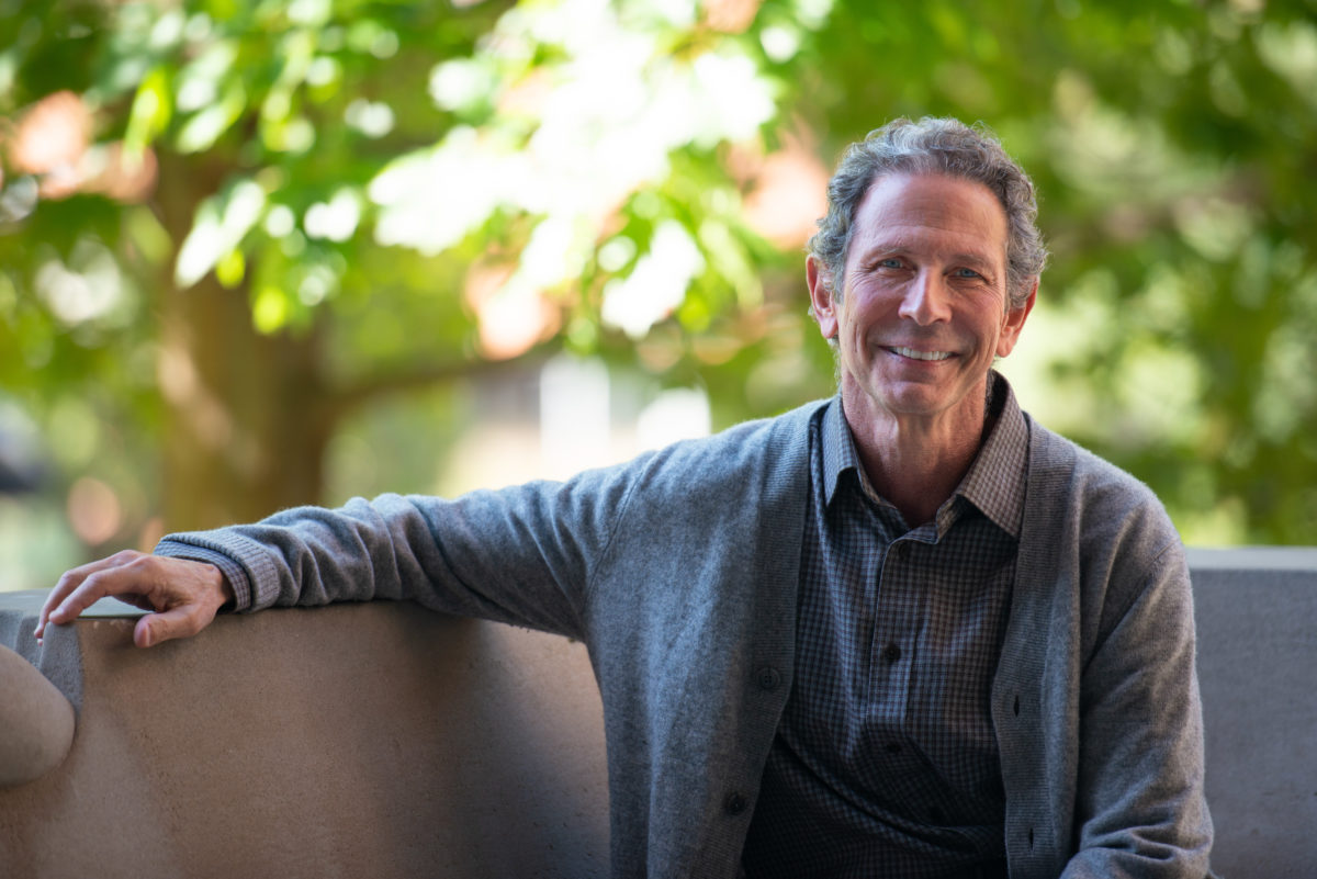 Photo of Dr. Bruce Klein sitting in an outdoor setting