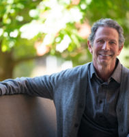 Photo of Dr. Bruce Klein sitting in an outdoor setting