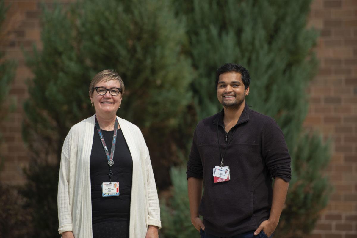 Photo of Margo L. Hoover-Regan, MD, and Sudarshawn “Shawn” N. Damodharan, DO, in an outdoor setting