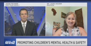 Screen shot of TV news program showing a split screen with Spectrum News 1 anchor Jason Fechner and UW Health Kids pediatrician Dr. Laura Houser