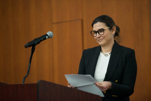 Dr. Pelin Cengiz at microphone