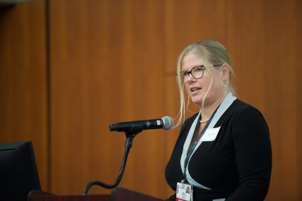 Dr. Megan Moreno speaking into microphone