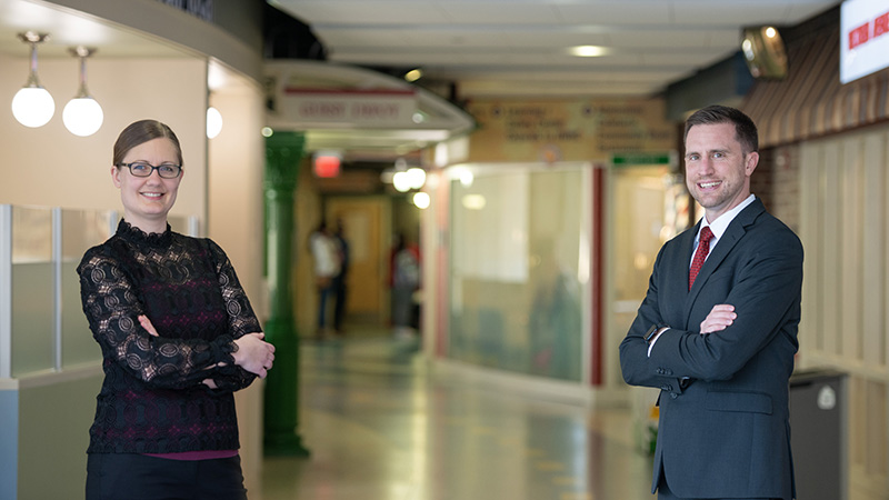 Dr. Emma Mohr and Dr. Matthew Harar standing in a hallway