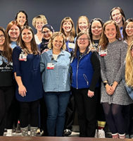 Group of 22 people smiling at camera