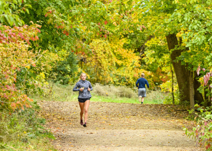Pedestrians and students walk among the colors of the fall leaves on the Howard Temin Lakeshore Path near Picnic Point at the University of Wisconsin-Madison during autumn on October 25, 2021. (Photo by Bryce Richter / UW-Madison)