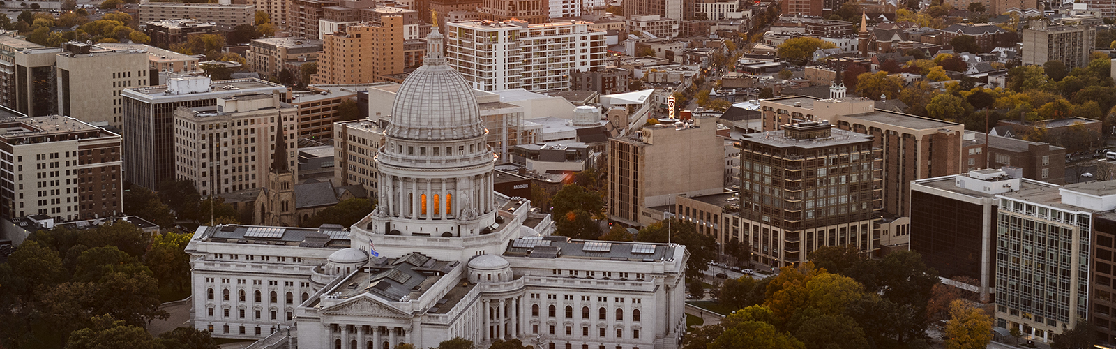 An aerial view of the Wisconsin State Capitol and surrounding city.