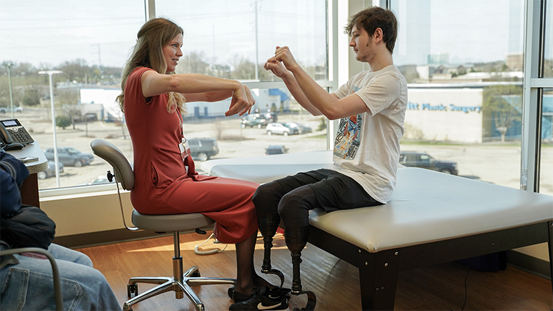 Deanna Jewell with a patient in the limb difference clinic