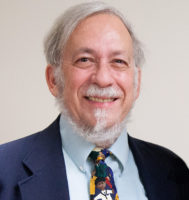 Dr. Murray Katcher wearing a colorful tie with children on it.