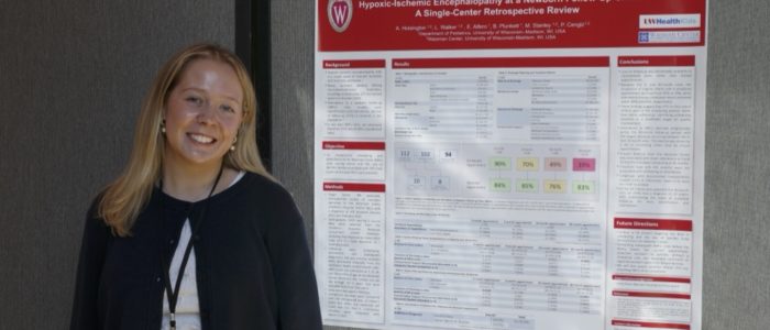 MSPR 2026 Department of Pediatrics trainee standing in front of their research poster at MSPR 2026